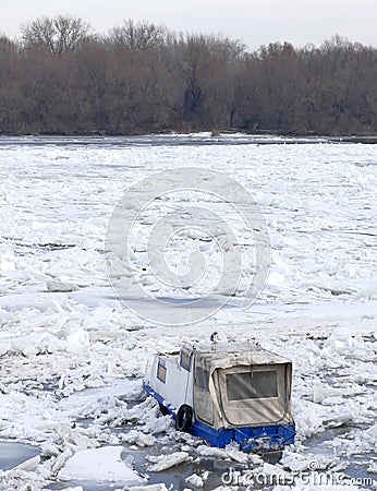 Trapped boat into the frozen Danube river Editorial Stock Photo