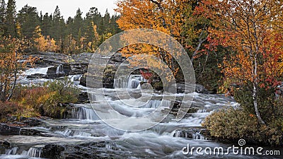 Trappstegsforsen waterfall in autumn along in Lapland in Sweden Stock Photo