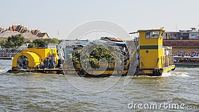 Trash-cleaning boat on the Chao Phraya River Editorial Stock Photo