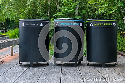 Trash containers on city street. Colorful metal containers in a row for separate garbage trash collection Stock Photo