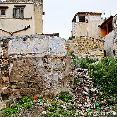 Trash and crumbling wall in a Palermo neighborhood Stock Photo