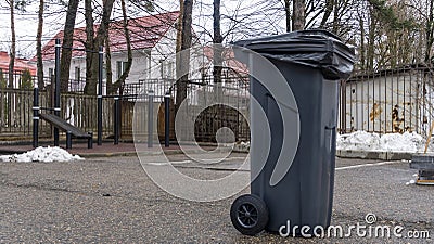 Trash Garbage Full Container In Street. Do not litter on the street in the city. Ecological problem concept Stock Photo