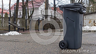 Trash Garbage Full Container In Street. Do not litter on the street in the city. Ecological problem concept. Stock Photo