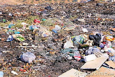 Trash piles at an improvised and illicit dump site. Editorial Stock Photo