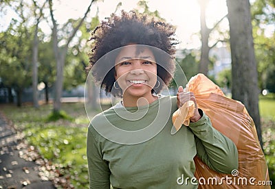 Trash, volunteer portrait and black woman cleaning garbage pollution, waste product or environment support. Plastic bag Stock Photo