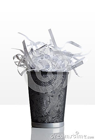 Trashcan full of shredded paper Stock Photo