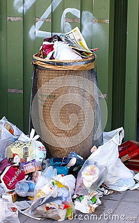 Trashcan with lots of garbage Editorial Stock Photo