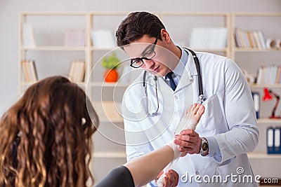 The traumatologist is taking care of the patient Stock Photo