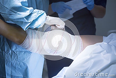 Traumatology orthopedic surgery knee bandaging Stock Photo