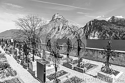Old cemetery at the church yard with mountain view Editorial Stock Photo