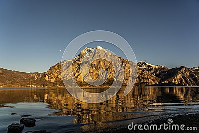 Traunstein during sunset in Austria, Austrian alps during sunset with a lake in the foreground, mountains during sunset austria Stock Photo