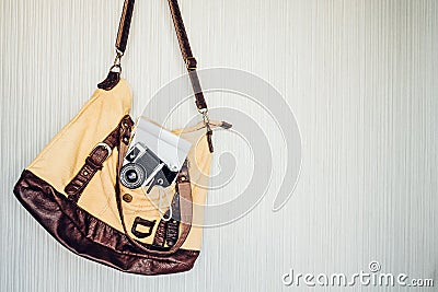 Travel accessories. camera, pen, notebook and torch in bag ready Stock Photo