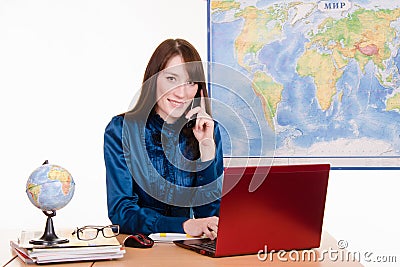 Travel agency employee talking on the phone Stock Photo