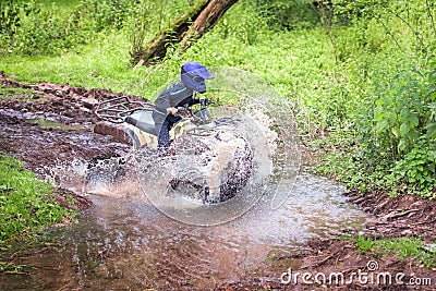 Travel on ATVs in river Stock Photo