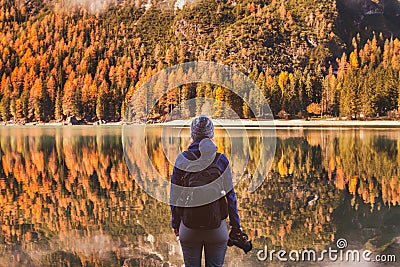 Travel in autumn outdoors, photographer traveler with backpack and dslr camera Stock Photo