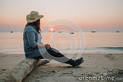 Travel background beautiful young women sit alone beach with sea Stock Photo