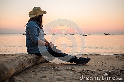 Travel background beautiful young women sit alone beach with sea Stock Photo