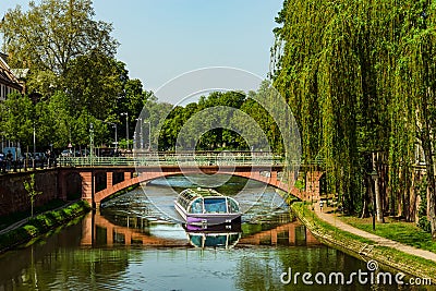Travel boat in Strasbourg . Reflections in the river Ill Stock Photo
