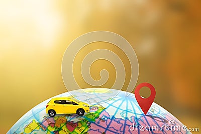 Yellow model toy on globe running to destination checkpoint with sunlight in background. Stock Photo