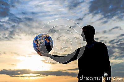 Travel concept with man hand and round earth with landmarks. Stock Photo