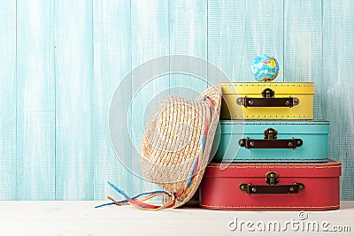 Travel concept with retro style suitcases, straw hat and globe o Stock Photo