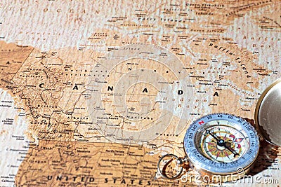 Travel destination Canada, ancient map with vintage compass Stock Photo