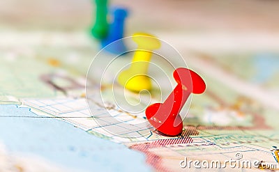 Travel destination points on a map indicated with colorful thumbtacks and shallow depth of field with space for copy Stock Photo