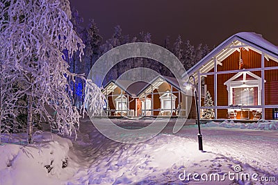 Travel Destinations Concepts. Line of Traditional Lapland Suomi Houses Stock Photo