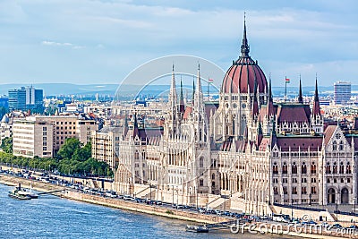Travel and european tourism concept. Parliament and riverside in Budapest Hungary with sightseeing ships during summer day with bl Editorial Stock Photo
