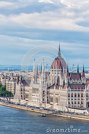 Travel and european tourism concept. Parliament and riverside in Budapest Hungary during summer sunny day with blue sky and clouds Stock Photo