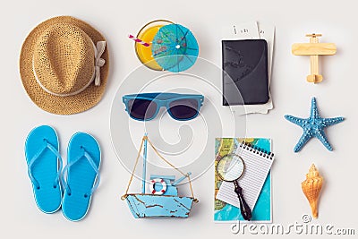 Travel holiday vacation concept with beach and travel items organized on white background Stock Photo