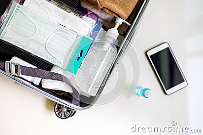 Travel,holidays and summer vacations concept,preparation and traveling in new normal life,preparing the luggage,add medical mask, Stock Photo