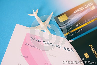 Travel insurance application form with passport credit cards airplane flight travel traveller fly travelling citizenship air Stock Photo