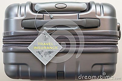 Travel insurance protection plan for airline safety and security with tag on passenger suitcase luggage handle Stock Photo