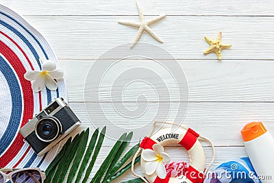 Travel Plan. Traveler planning trips summer vacations on the beach with Traveler`s accessories, retro camera, sunblock, sunglass Stock Photo