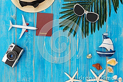 Travel Plan. Traveler planning trips summer vacations on the beach with Traveler`s accessories, retro camera, sunblock, sunglasse Stock Photo