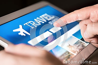 Travel search engine and website for holidays. Man using tablet to look for cheap flights and hotels. Stock Photo