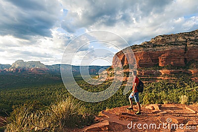 Travel in Sedona, man Hiker with backpack enjoying view, USA Stock Photo