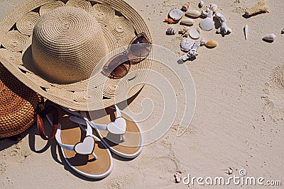 Travel suitcase and accessories such as glasses, flip flops, lying on the beach, product photo for travel agencies and resorts, ma Stock Photo