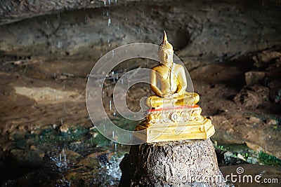 Travel Thailand - Buddha statue in Tham Kra Sae With drops rain as a background. Stock Photo