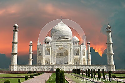 Travel to Agra, India, Taj Mahal and Red Stormy Sky Stock Photo