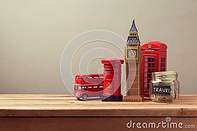 Travel to Great Britain concept with souvenirs and money box jar. Planning summer vacation Stock Photo