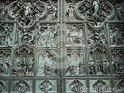 Decorated outdoor doors of Milan Cathedral Stock Photo