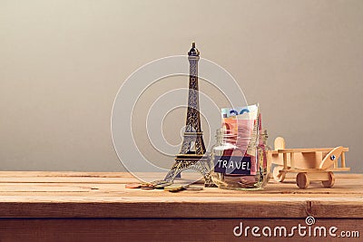 Travel to Paris, France concept with Eiffel Tower souvenir and wooden airplane toy. Planning summer vacation Stock Photo