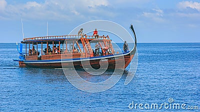 Travel tour for small group of foreign tourists with guide on traditional long tail boat ship visiting for snorkeling,diving Editorial Stock Photo