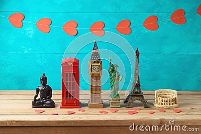 Travel and tourism background with souvenirs from around the world Stock Photo