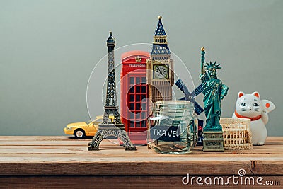 Travel and tourism concept with souvenirs from around the world. Planning summer vacation, money budget trip concept. Saving money Stock Photo