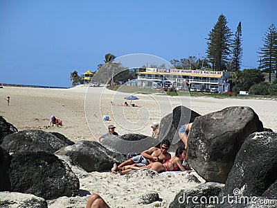 Travel and Tourism - Magical beach encrusted with beautiful breezy palm trees and volcanic rocks, Coolangatta Qld Australia Editorial Stock Photo