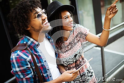 Travel, tourism, summer vacation, technology and friendship concept - smiling couple with tablet pc Stock Photo