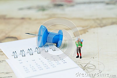 Travel, tourism, vacation or wanderlust life concept, miniature young man backpacker standing on vintage world map with compass, Stock Photo